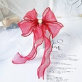 Detail view of red organza bow collar with a pearl center for cats and dogs - Burgundy