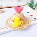 Detail of straw pet sun hat featuring a plush yellow duck and pink knitted heart deco - S / Pink Heart