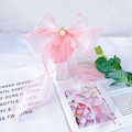 Detailed view of pink organza bow collar with pearl center for cats and dogs - XS / Light Pink