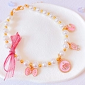 Charming handmade pet pearl necklace with large pink bow and glittery gold charms - XS / Pink Necklace