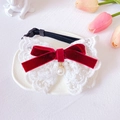 Detail of adjustable pet lace collar with red velvet bow and elegant pearl pendant - XS / Burgundy
