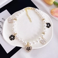 Luxury pet pearl necklace with camellia charms and heart pendant on a white tray - XS / Heart Black White Camellia Necklace