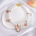 Close-up of pet pearl necklace with pink bow, moon charms and rhinestone details - XS / Pink Pearl Bow Necklace
