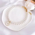 Detail of pet pearl necklace with a vintage golden rose pendant on white silk background - XS / White Rose Necklace