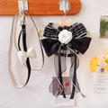 Close-up of dog harness with camellia flower, pearl fringe, and tweed texture - Small / Black Bow Ribbon