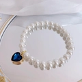 Elegant cat pearl necklace with deep blue heart gemstone pendant in vintage style - Heart Peacock Green