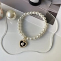 Elegant pet pearl necklace featuring a black heart pendant with a white camellia flower - XS / Chanel Style Black Heart