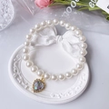 Elegant pearl pet necklace featuring a golden heart pendant with iridescent gemstone - Rainbow