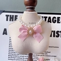Sweet pet necklace with white pearls and a pink plaid bow on a mini display stand - Pink Gingham with Bow