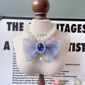 Elegant pet pearl necklace with large iridescent organza bow and blue gemstone - Blue Bow