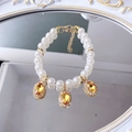 Dual-strand pearl pet collar with amber-colored gemstones and sparkling rhinestones - Champagne