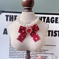 Red bow pet pearl necklace with white heart prints and a sparkling heart gem - Heart Pattern Bow