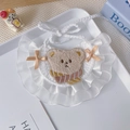 Handmade crochet pet bib with bear patch, lace trim, and orange ribbons on white tray - S / Khaki Bear Bib