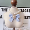 Elegant pet pearl necklace featuring a blue checkered bow and a vintage gold gemstone - Blue Plaid Bow