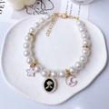 Chic pet pearl necklace featuring a vintage flower pendant and celestial charms - XS / Black Rose Pearl Chain