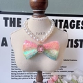 Elegant pet pearl necklace featuring a rainbow sequin bow and pink gemstone - Multicolor Sequin Bow