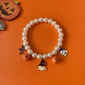 Halloween pet pearl collar with orange pumpkin bells and bat charms on orange background - XS / Witch Hat