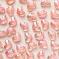 Irisierende rosa Acrylperlen in Herzform für DIY-Schmuck und Bastelprojekte - 100 Stück Set / Rosa