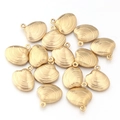 Detailed view of 15 gold plated stainless steel scallop shell charms for DIY jewelry making - 5 Pieces / Gold Scallop