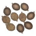 Set of 10 antique bronze alloy oval pendant trays with vintage filigree floral edges - Small / Bronze