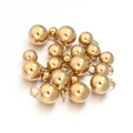 Close-up of polished gold-plated stainless steel round beads with hanging loops - 3mm / Gold