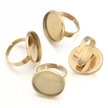 Detailed view of four golden adjustable ring bases with round flat bezel trays for DIY - 6mm / Gold
