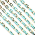 Macro view of gold metal and turquoise marble acrylic chain links for DIY jewelry making - 10x15mm Ring, 1 Meter Length / Gold And Turquoise Blue