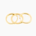 Close-up of three golden flat split metal key rings for DIY jewelry and keychain making - 20mm / Gold