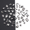 Macro detail of various black crystal nail art rhinestones with multifaceted geometric cuts - Black - Irregular