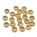 Close-up of vintage bronze alloy spacer beads with twisted texture for jewelry DIY - Antique Gold Twist Rope Style (4) / 8MM (100 Pieces/Pack)