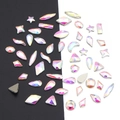 Macro detail of AB iridescent mixed shape flatback crystals for DIY nail art and jewelry - AB White - Irregular