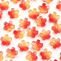 Macro view of gradient cherry blossom glass beads with gold glitter for DIY jewelry making - Red Yellow Sakura