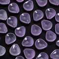 Macro shot of light purple translucent plum petal beads for DIY vintage jewelry making - Pink Plum Petal
