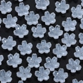Macro detail of translucent gradient cherry blossom beads for DIY jewelry making - White Cherry Blossom
