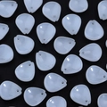 Macro shot of translucent white plum petal beads for DIY hairpins on black background - White Plum Petal