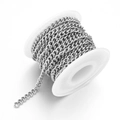 Detail of silver curb chain roll for DIY jewelry making on white plastic spool - 1mm / Steel