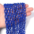 Vibrant royal blue acrylic link chain accessory held by hand for DIY jewelry making - Blue