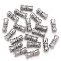 Close-up of 11mm silver brass peanut spiral clasps with detailed radial engraving - White K/Silver