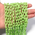 Hand holding light green acrylic chain links for DIY jewelry and accessory making - 50cm One Piece (Chain Width 13.5mm, Width 7.5mm, Wire Diameter 2mm) / Oval Link Chain (8575) / Fluorescent Green