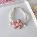 Detail of double-strand pet pearl necklace featuring a pink fabric flower and golden clasp - XS / Double Layer Necklace / Pink