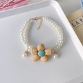 Detail of double-layer pearl pet necklace with handmade fabric flower and golden clasp - XS / Double Layer Necklace / Yellow