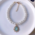 Elegant pet faux pearl necklace with a vintage blue crystal pendant and gold clasp - Sky Blue