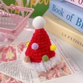 Detail of a handmade red and white crochet Christmas hat with colorful mini pompoms - One Size / Red Hat
