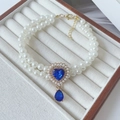 Detail of double-layer pearl necklace with blue heart gem and water drop pendant for pets - XS / Royal Blue