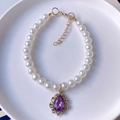 Pet faux pearl necklace featuring a vintage gold pendant with purple teardrop crystal - XS / Dark Violet