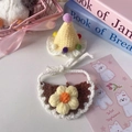 Detailed crochet texture of cream penguin style pet hat and floral bib for cats and dogs - One Size / Yellow Hat And Dark Brown Bib Style / Yellow Hat And Dark Brown Bib