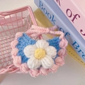 Close-up of handmade crochet pet bib with floral decor and pink woven straps - One Size / Blue Bib Style / Blue Bib