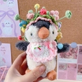 Plush penguin keychain with handmade floral hat and pink bib decoration - Multicolor Hat And Light Pink Bib