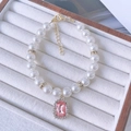 Elegant cat pearl necklace with pink square gemstone pendant and gold spacers - Light Pink