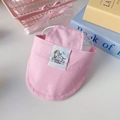 Close-up of pink canvas pet sun hat with adjustable elastic strap and woven logo detail - S / Pink